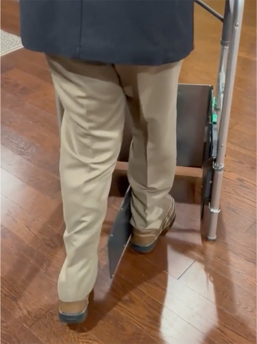 Older man walking with E-Z Gait